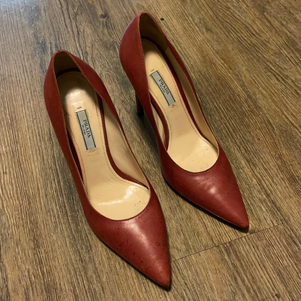 Prada *worn* red leather pumps